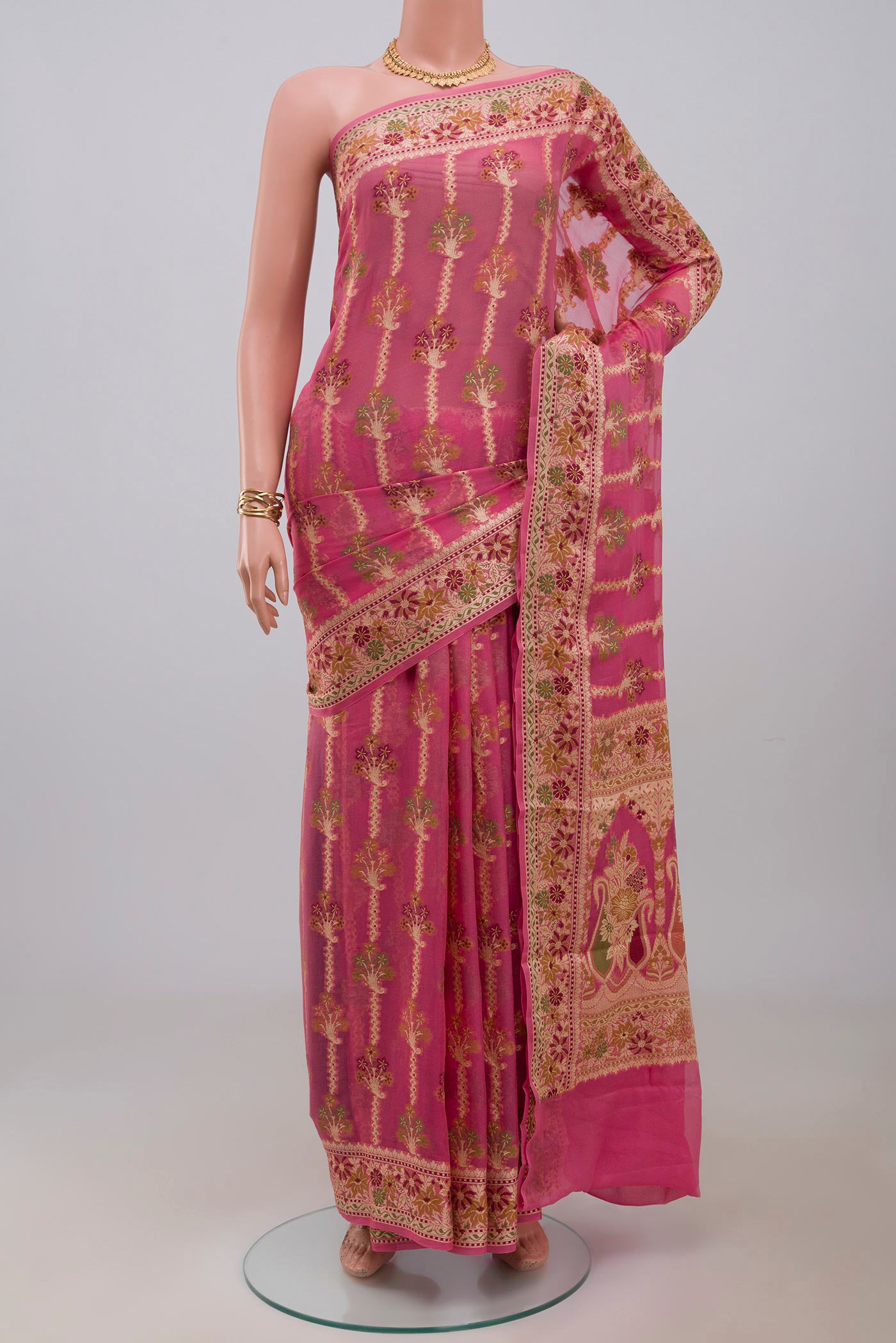 Pink Banarasi Georgette Saree with Thread Butta on the body and Zari And Thread Border.  displayed on a mannequin