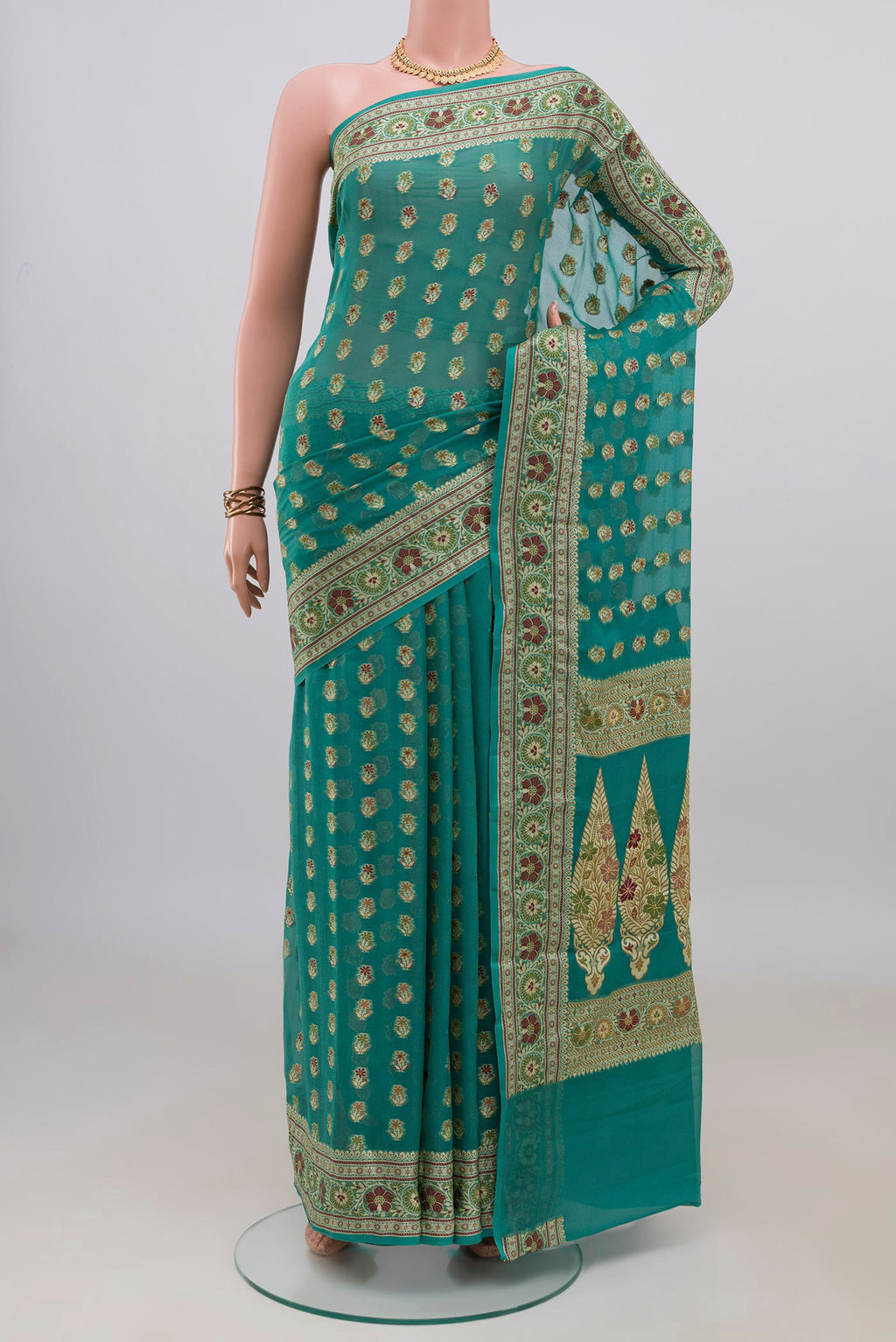 Sea Green Banarasi Georgette Saree with Zari And Thread Butta on the body and Zari Border.  displayed on a mannequin