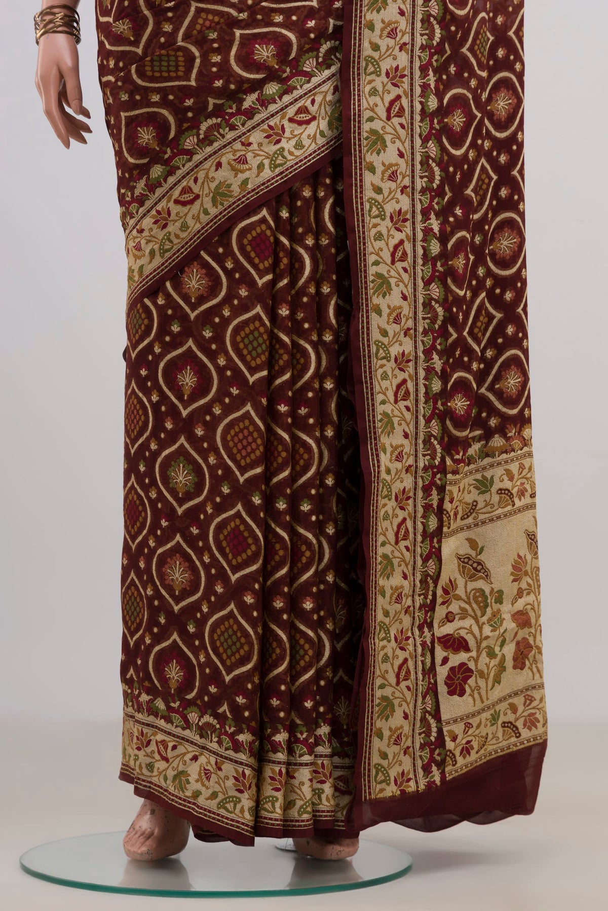 Pleats and pallu of Coffee Brown Banarasi Georgette Saree with Thread Brocade on the body and Fancy Border. 