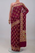 Magenta Banarasi Georgette Saree with Thread Butta on the body and Thread Border.  displayed on a mannequin