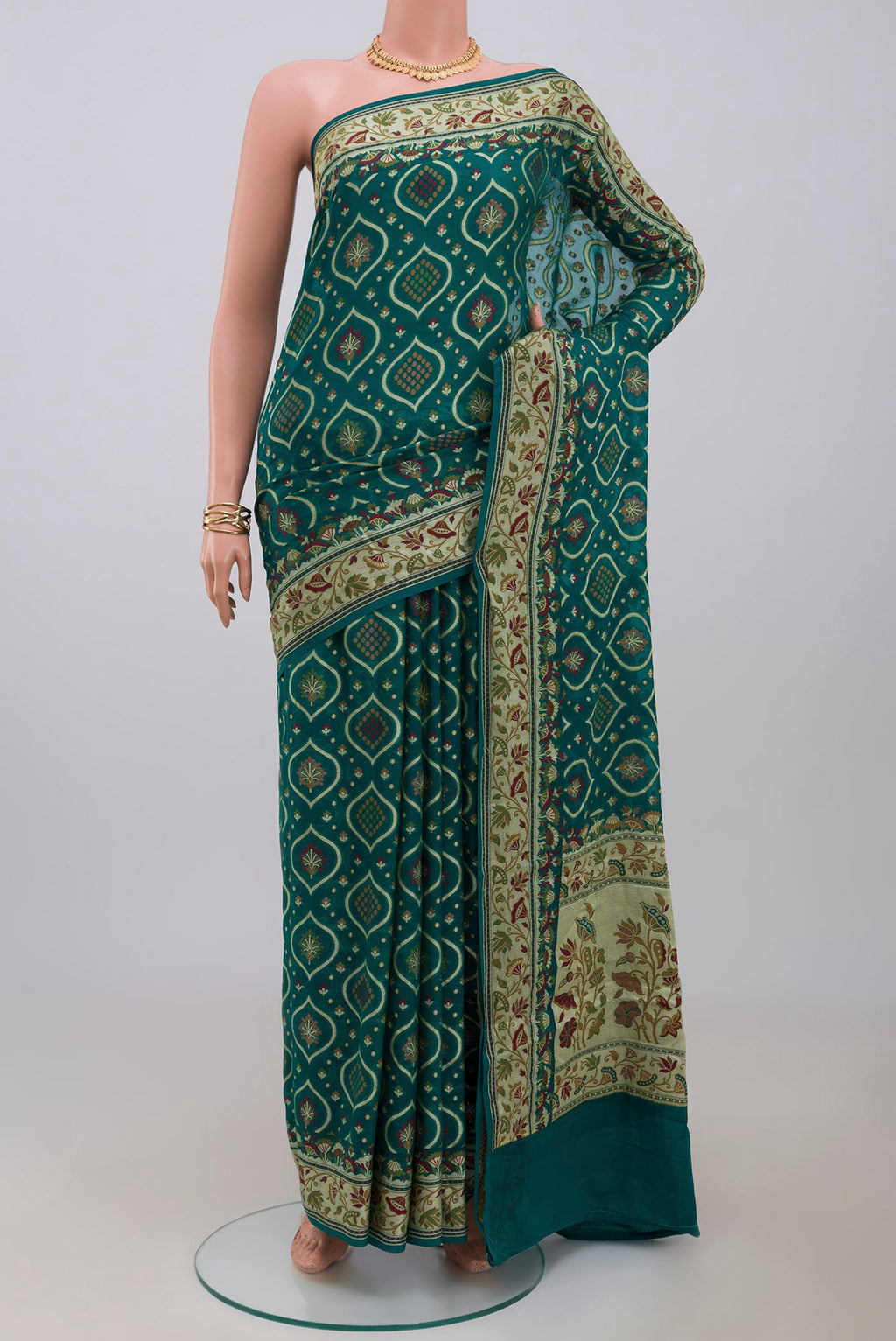 Green Georgette Saree with Fancy on the body and Fancy Border.  displayed on a mannequin