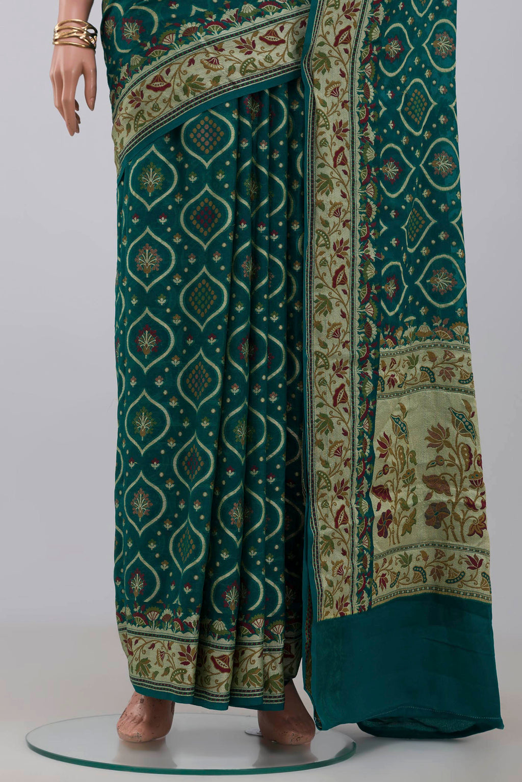Pleats and pallu of Green Georgette Saree with Fancy on the body and Fancy Border. 