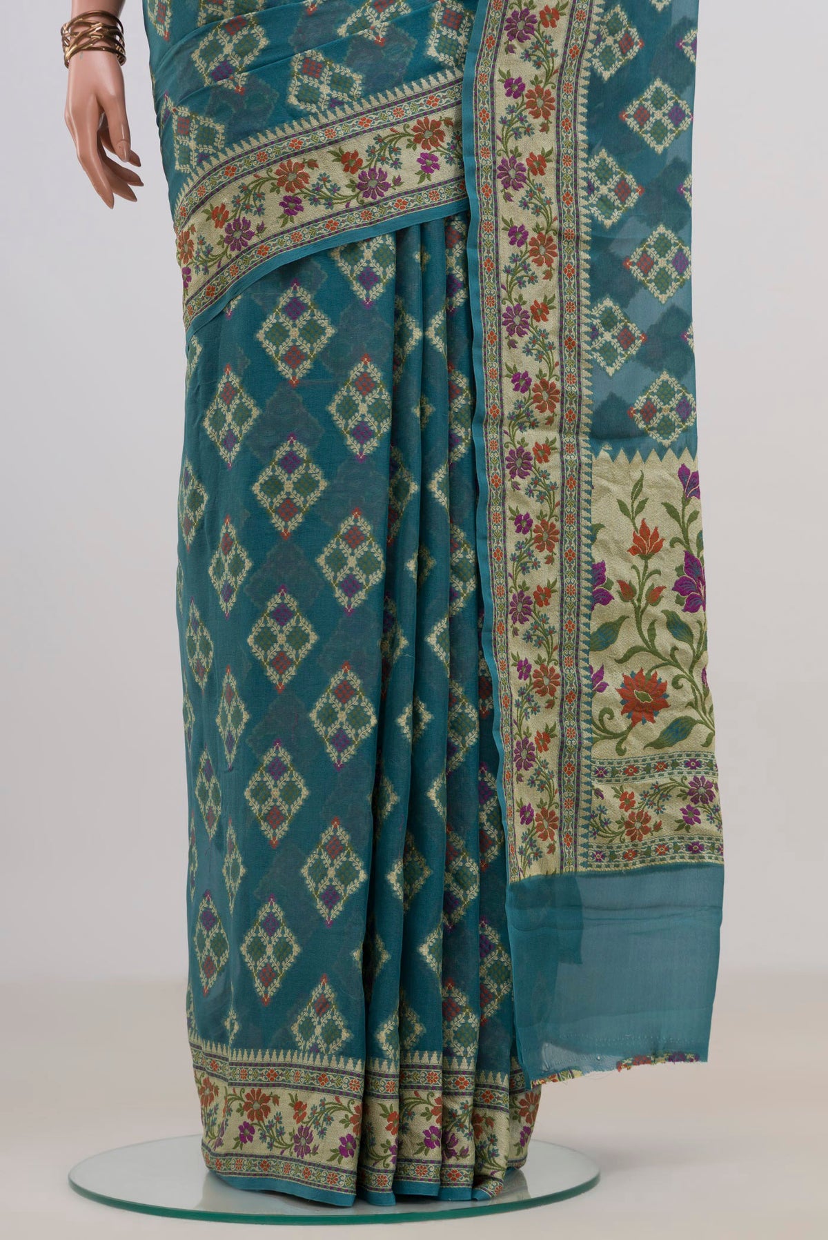 Pleats and pallu of Blue Grey Banarasi Georgette Saree with Thread Butta on the body and Thread Border. 