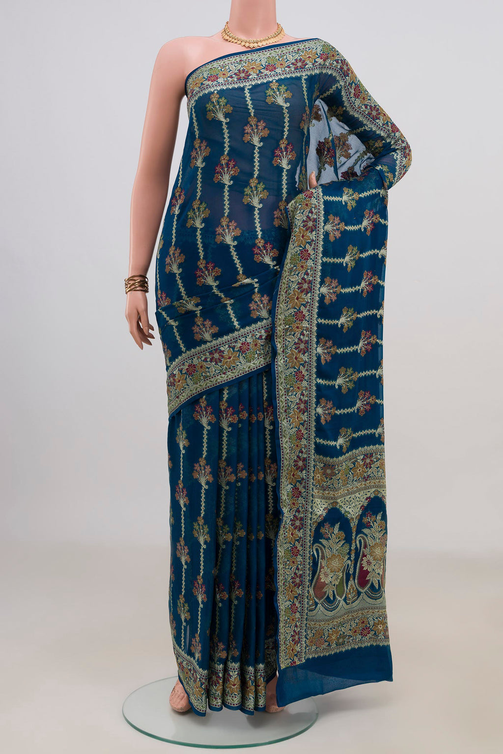 Blue Banarasi Georgette Saree with Thread Butta on the body and Fancy Border.  displayed on a mannequin