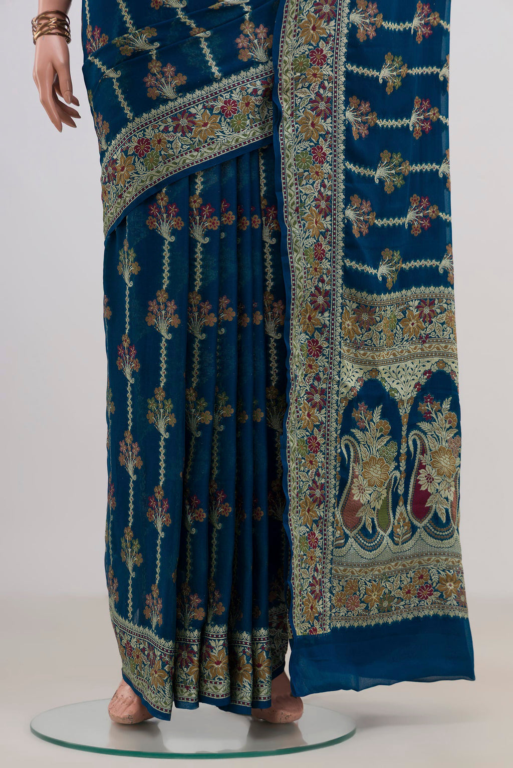 Pleats and pallu of Blue Banarasi Georgette Saree with Thread Butta on the body and Fancy Border. 