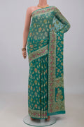 Blue Banarasi Georgette Saree with Thread Butta on the body and Thread Border.  displayed on a mannequin
