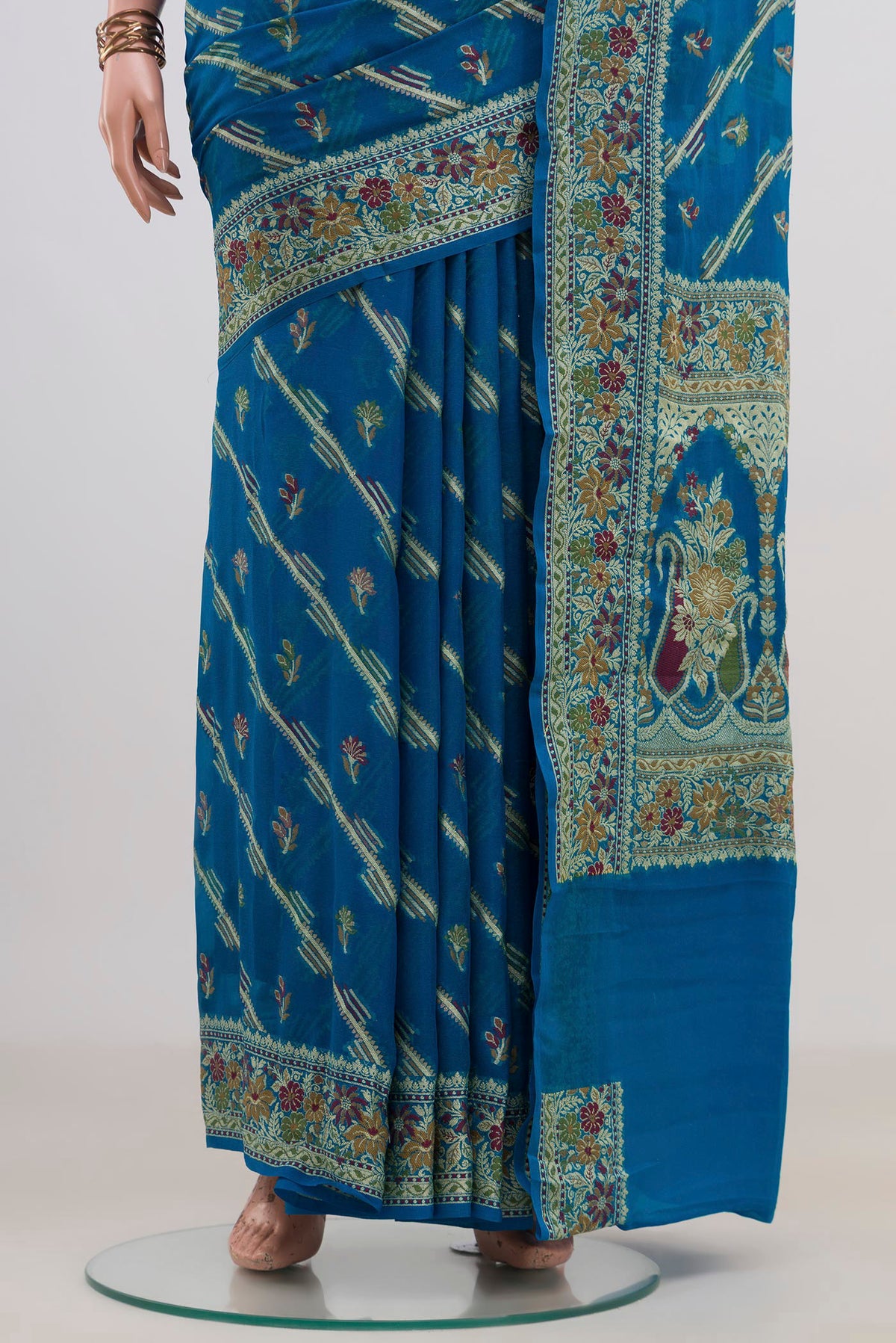Pleats and pallu of Blue Banarasi Georgette Saree with Thread Butta on the body and Fancy Border. 