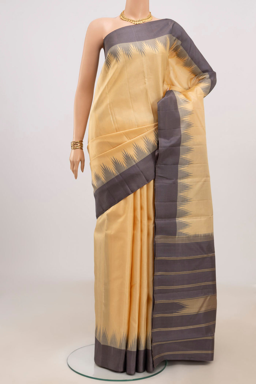 Sandal Kanchipuram Silk Saree with Plain Body and Temple Border.  displayed on a mannequin