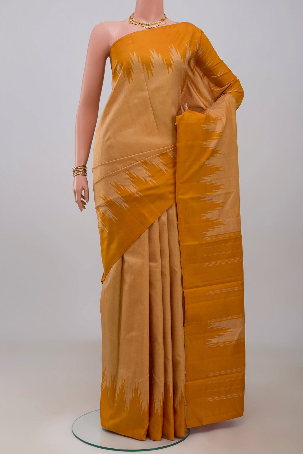 Sandal Kanchipuram Silk Saree with Plain Body and Temple Border.  displayed on a mannequin