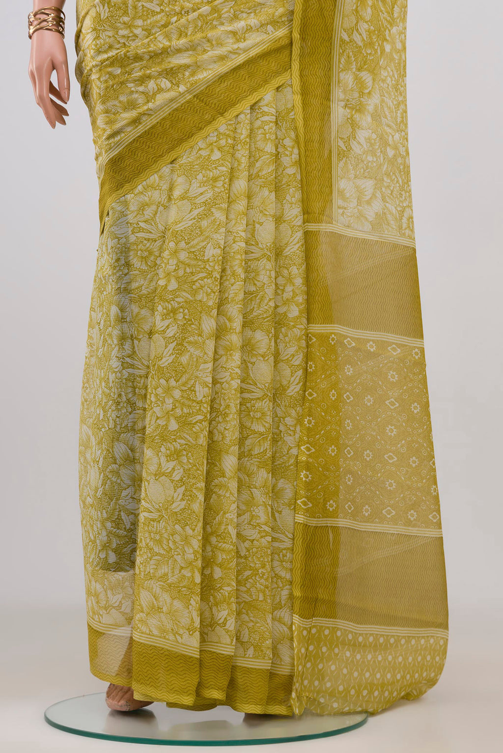 Pleats and pallu of Light Green Mysore Chiffon Saree with Floral Print on the body and Without Border. 