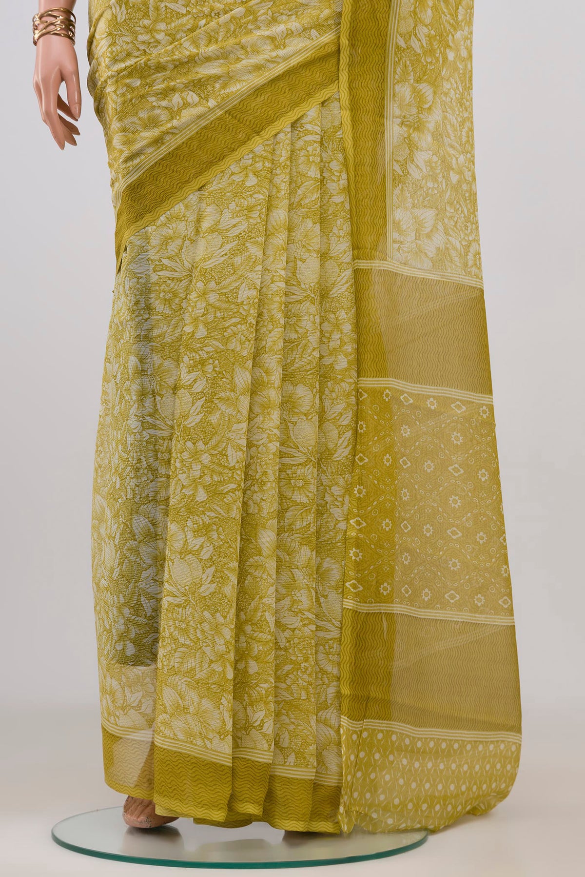Pleats and pallu of Light Green Mysore Chiffon Saree with Floral Print on the body and Without Border. 