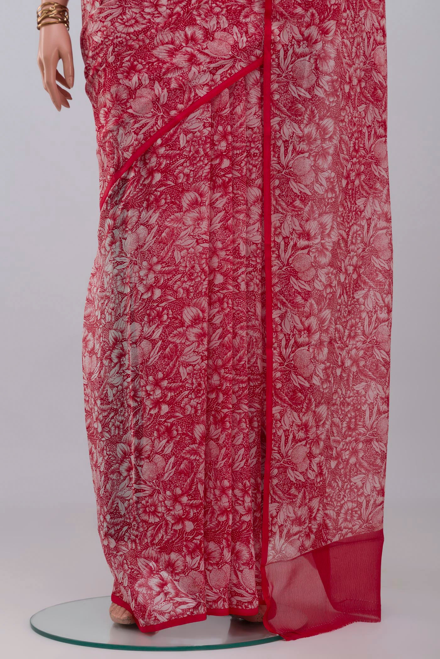Pleats and pallu of Red Mysore Chiffon Saree with Printed design on the body and Without Border. 