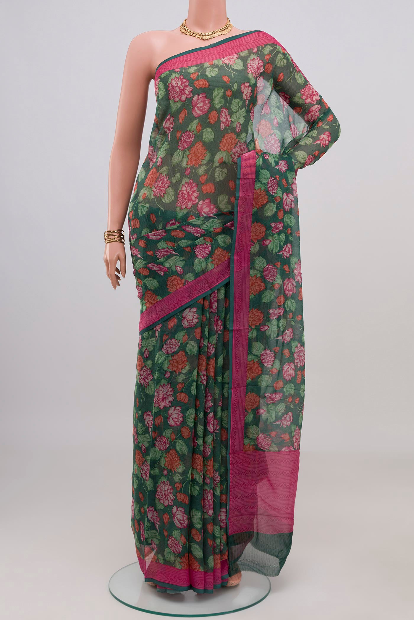 Green Mysore Chiffon Saree with Floral Print on the body and Printed Border.  displayed on a mannequin