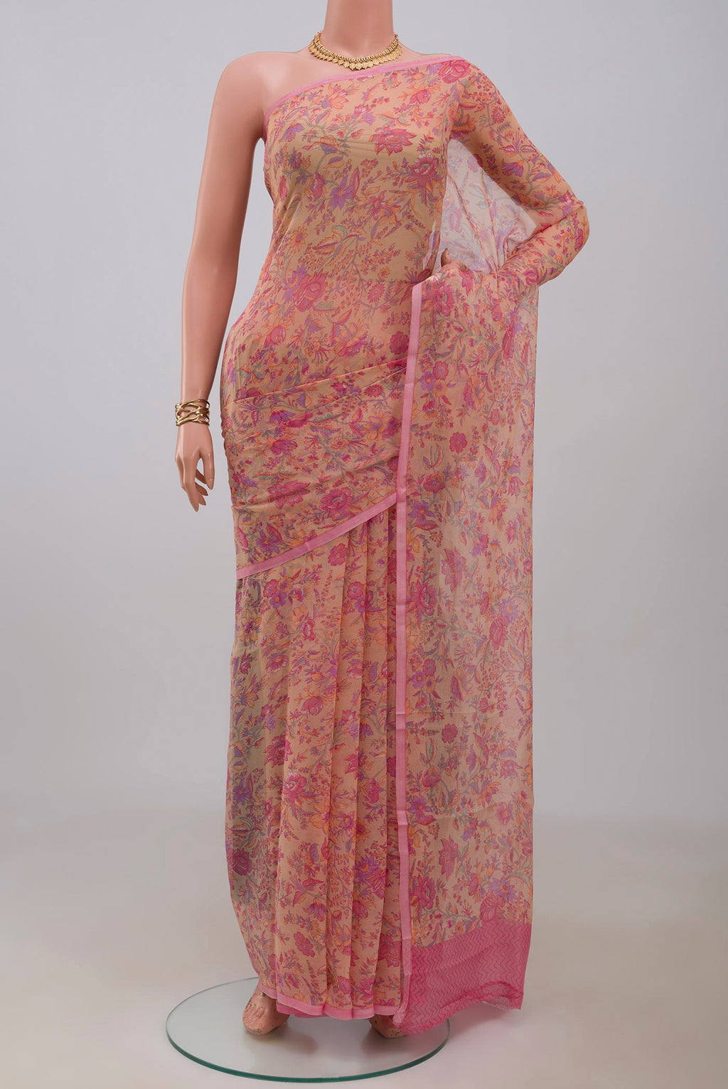 Peach Mysore Chiffon Saree with Printed design on the body and Without Border.  displayed on a mannequin