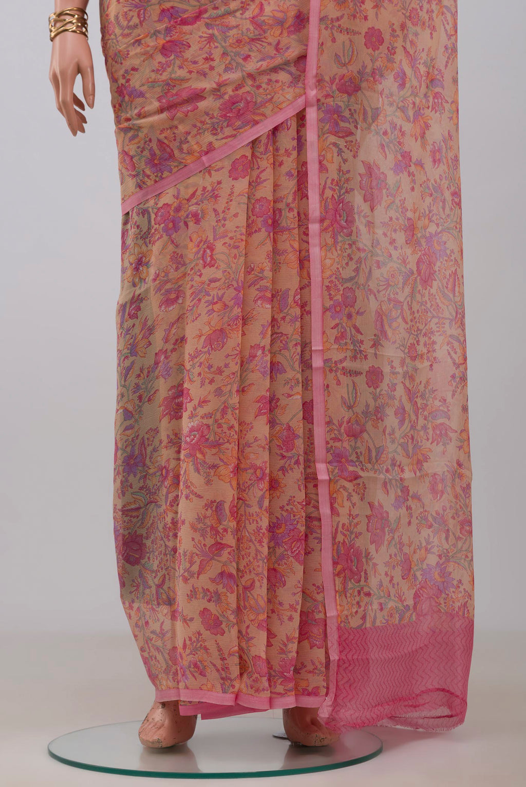 Pleats and pallu of Peach Mysore Chiffon Saree with Printed design on the body and Without Border. 