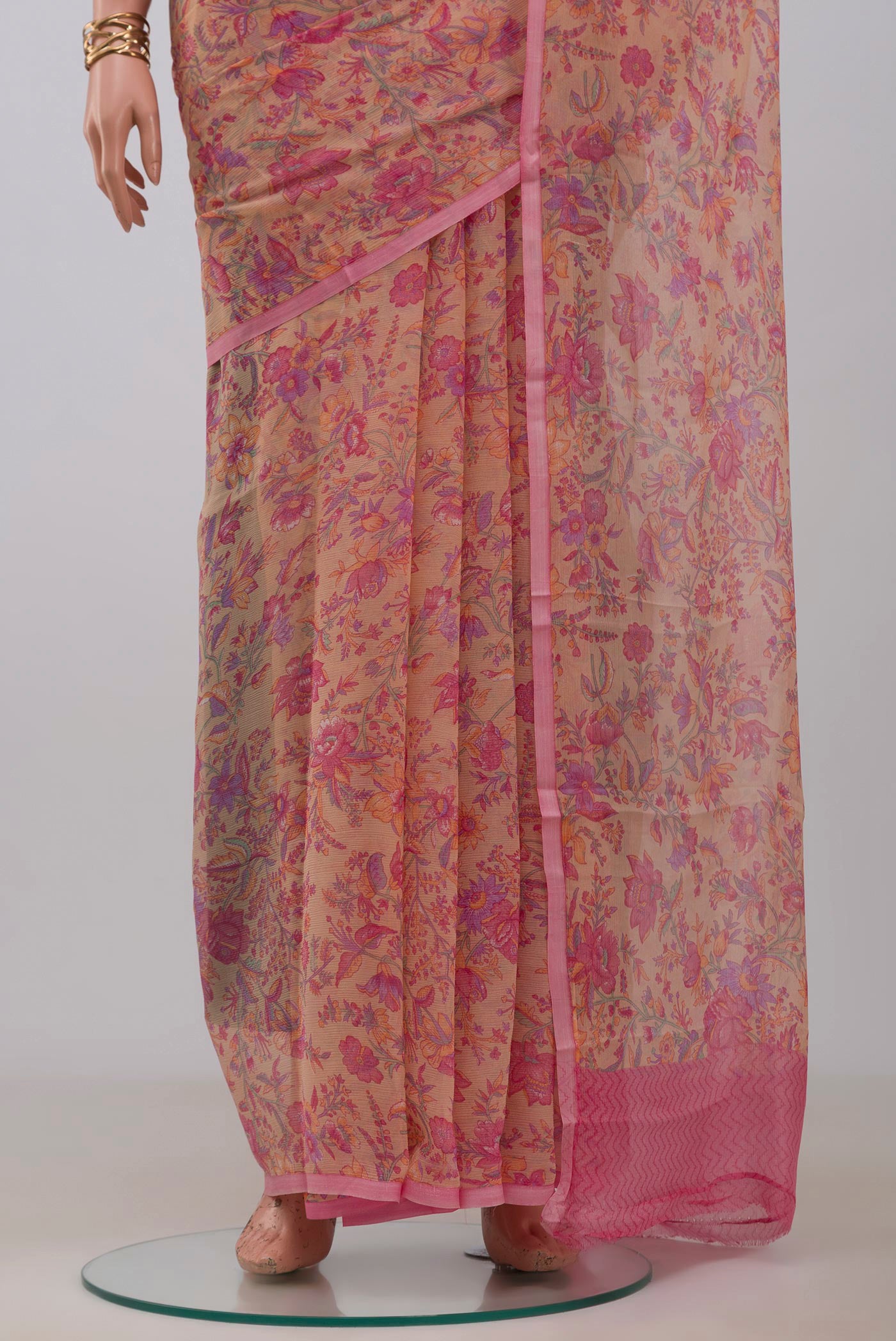 Pleats and pallu of Peach Mysore Chiffon Saree with Printed design on the body and Without Border. 