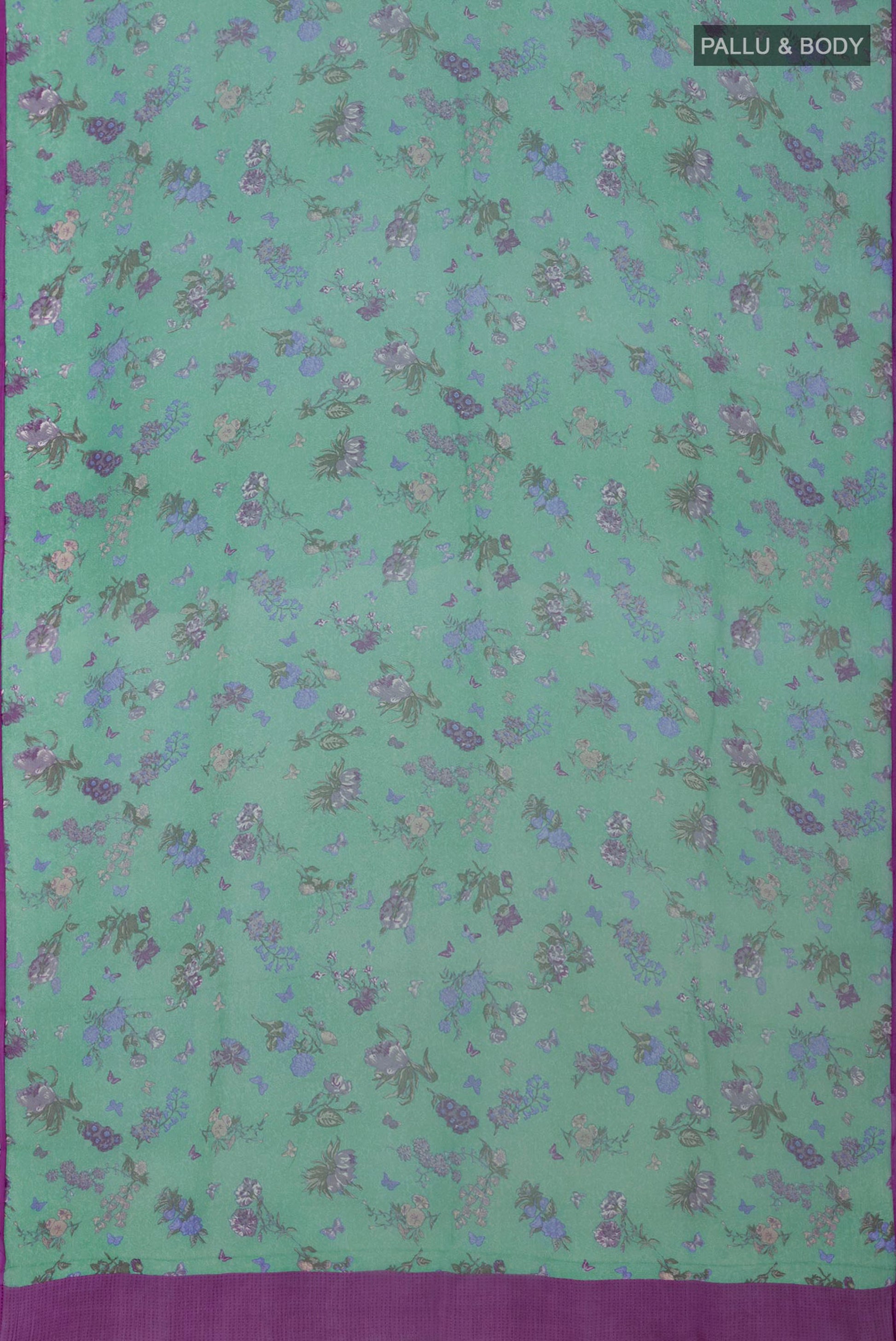Flat view of Green Chiffon Saree with Printed design on the body and Without Border. 
