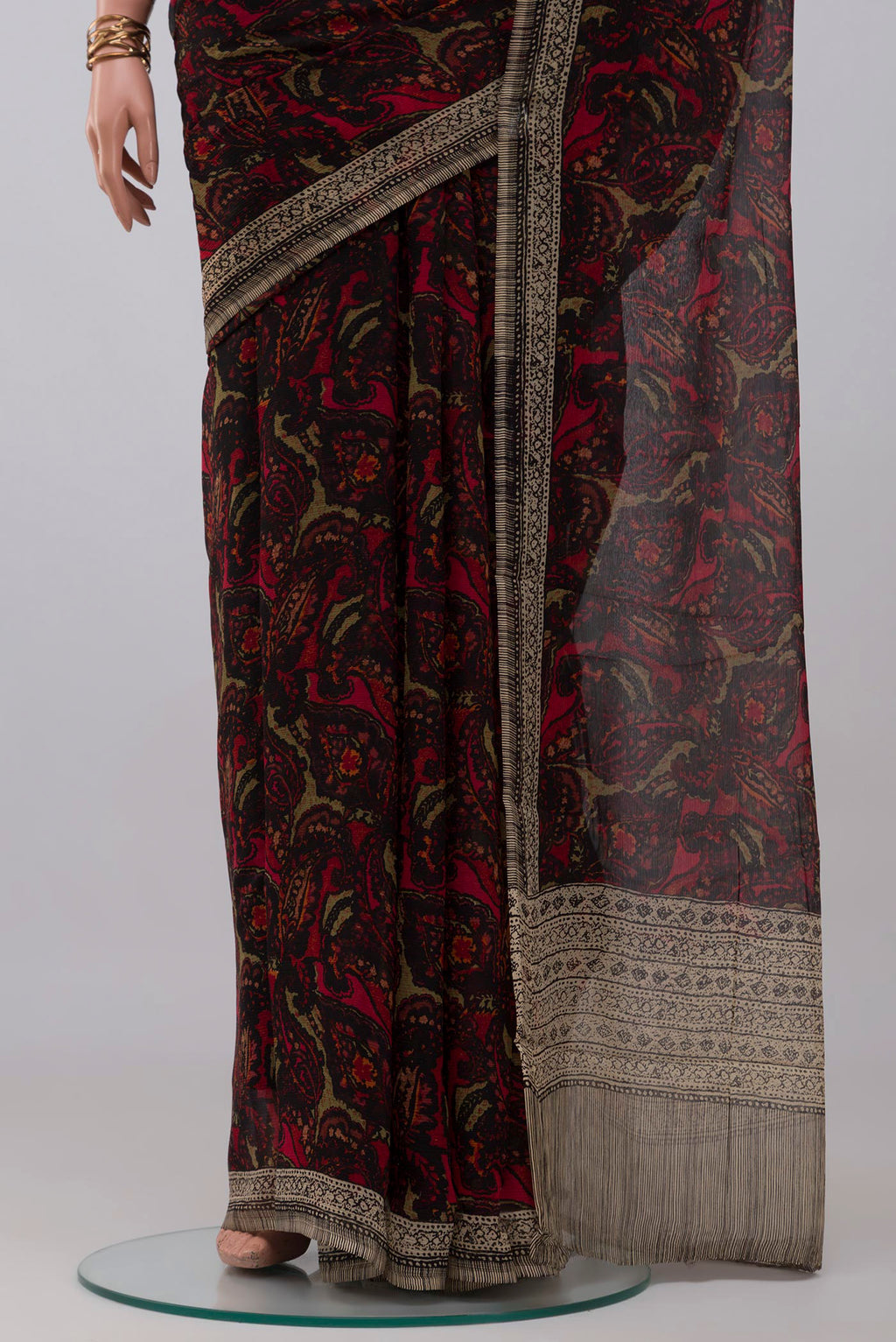 Pleats and pallu of Black Mysore Chiffon Saree with Printed design on the body and Printed Border. 