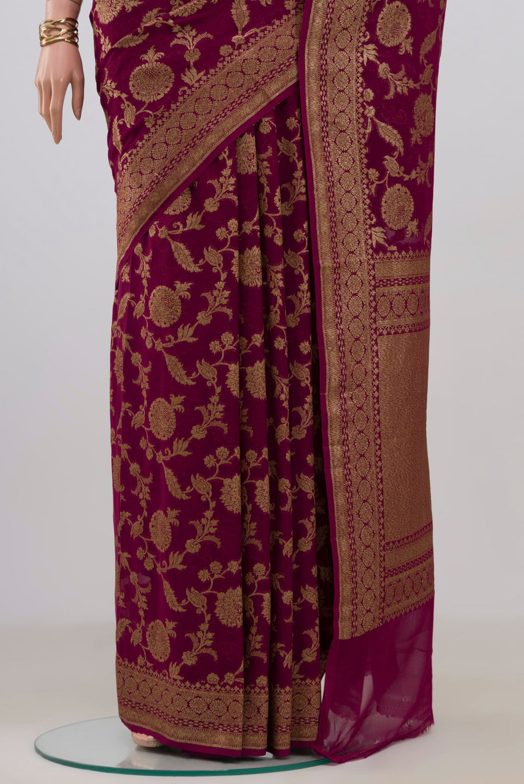 Pleats and pallu of Magenta Banarasi Georgette Saree with Zari Brocade on the body and Zari Border. 
