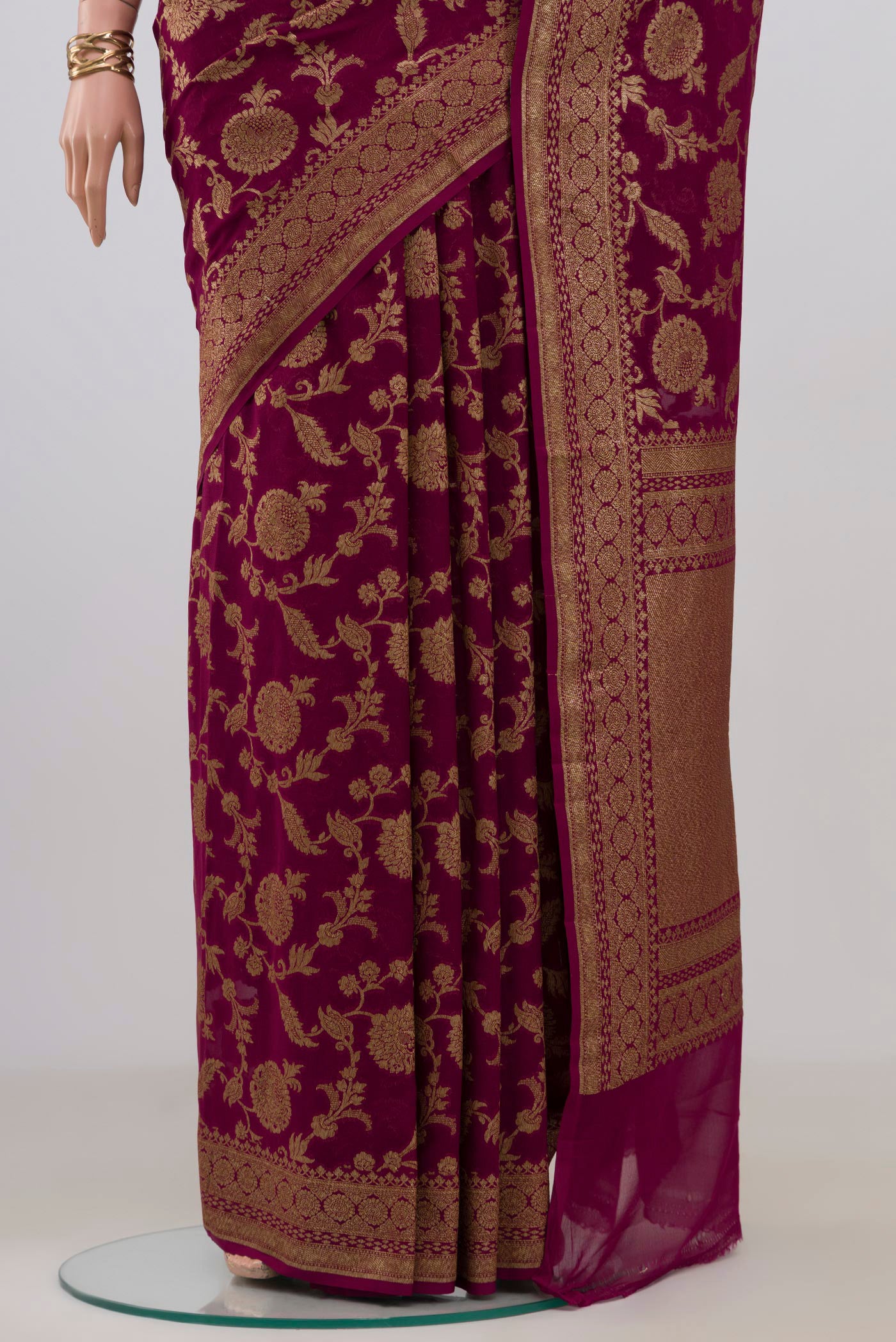 Pleats and pallu of Magenta Banarasi Georgette Saree with Zari Brocade on the body and Zari Border. 