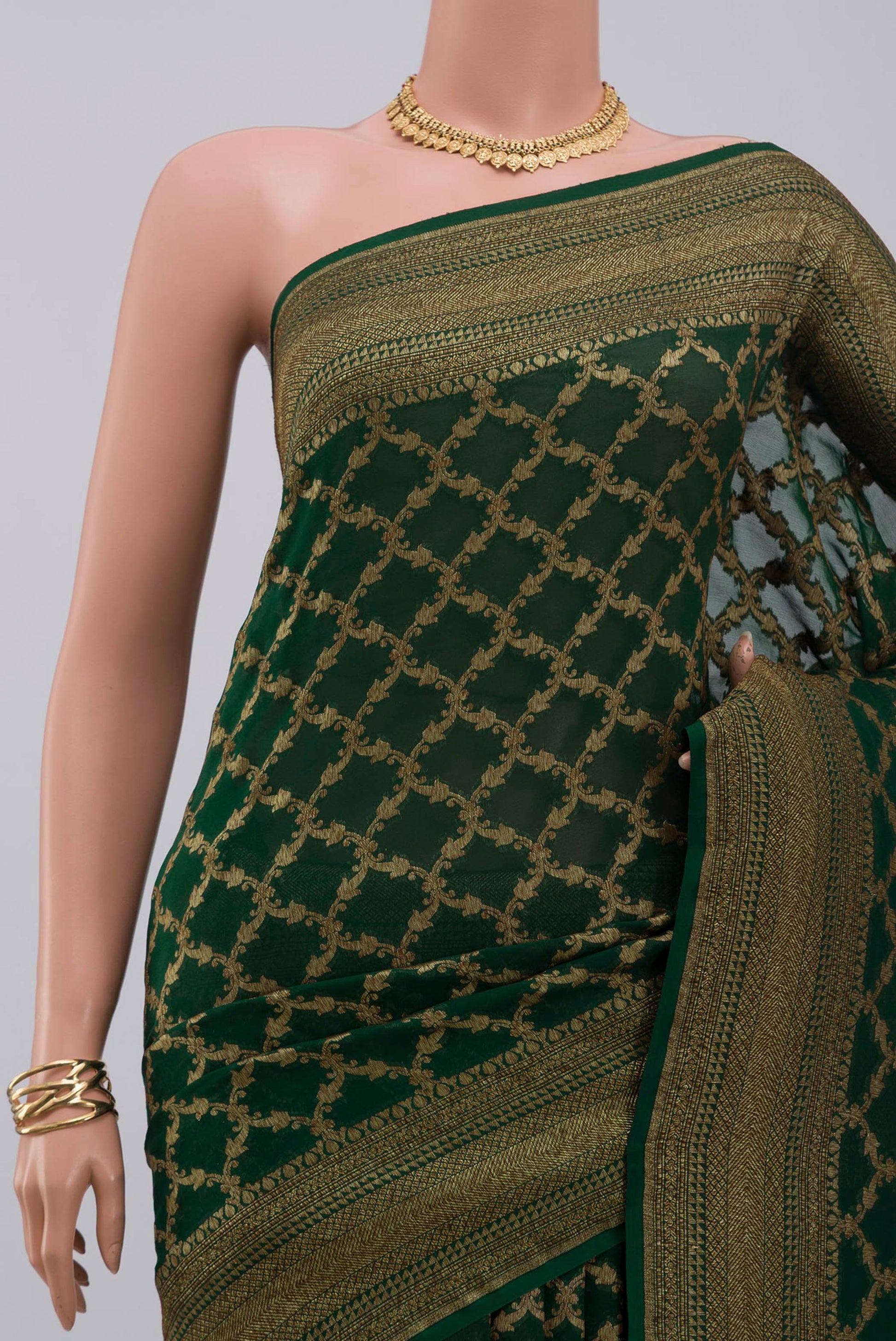 Border image of Green Georgette Saree with Fancy on the body and Zari Border. 