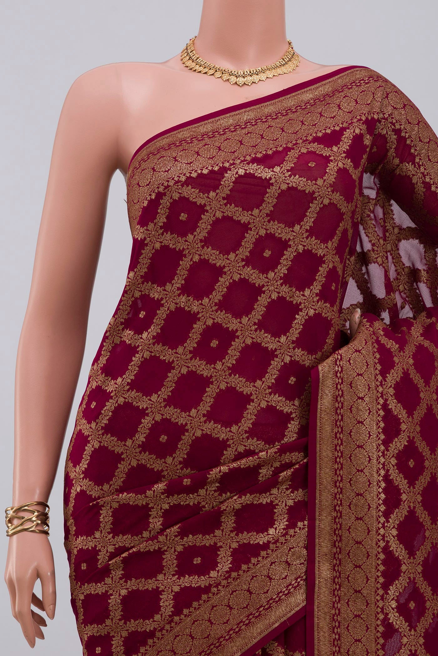 Border image of Maroon Georgette Saree with Fancy on the body and Fancy Border. 