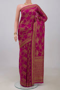 Pink Georgette Saree with Fancy on the body and Fancy Border.  displayed on a mannequin
