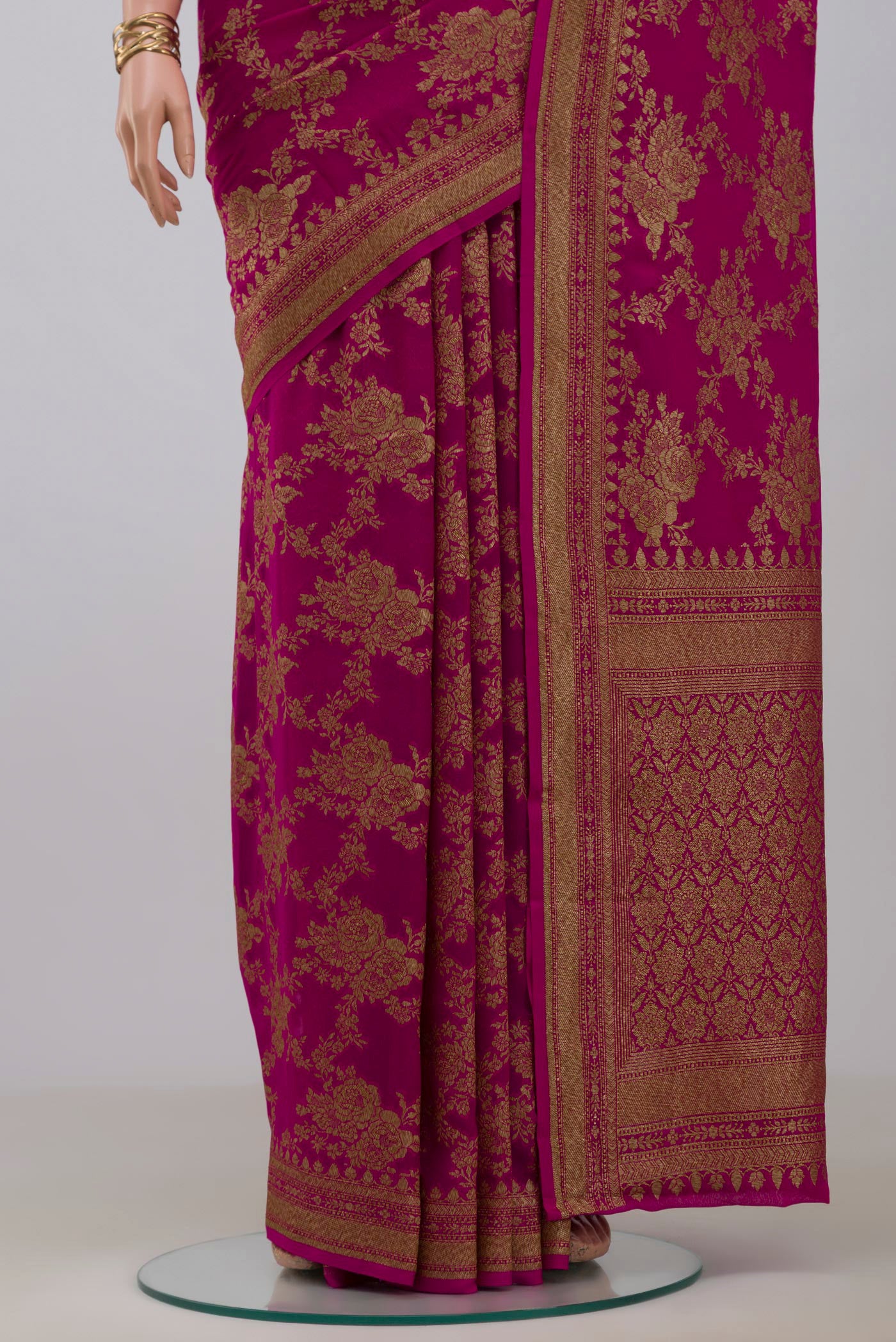 Pleats and pallu of Pink Georgette Saree with Fancy on the body and Fancy Border. 