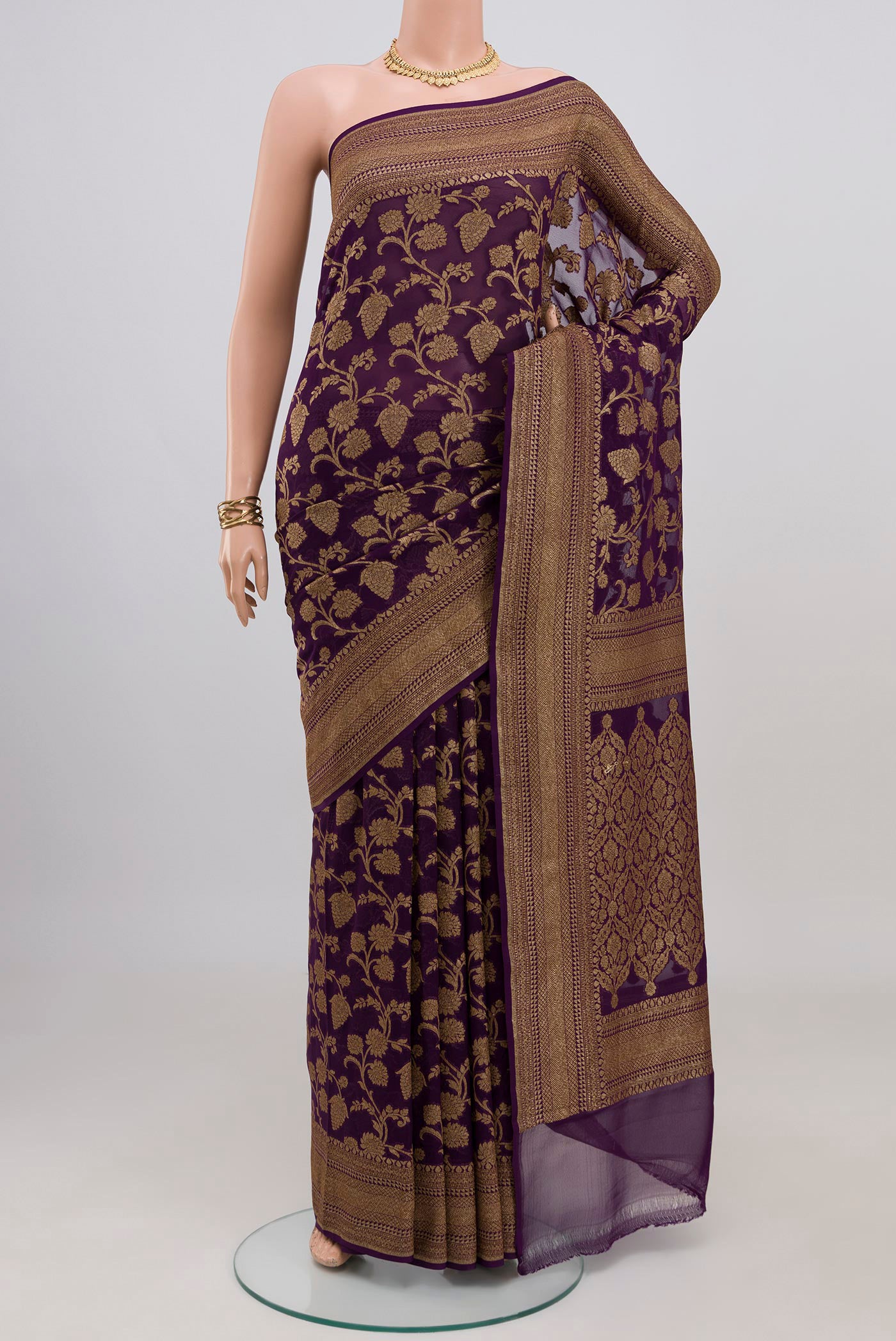 Purple Banarasi Georgette Saree with Zari Brocade on the body and Zari Border.  displayed on a mannequin