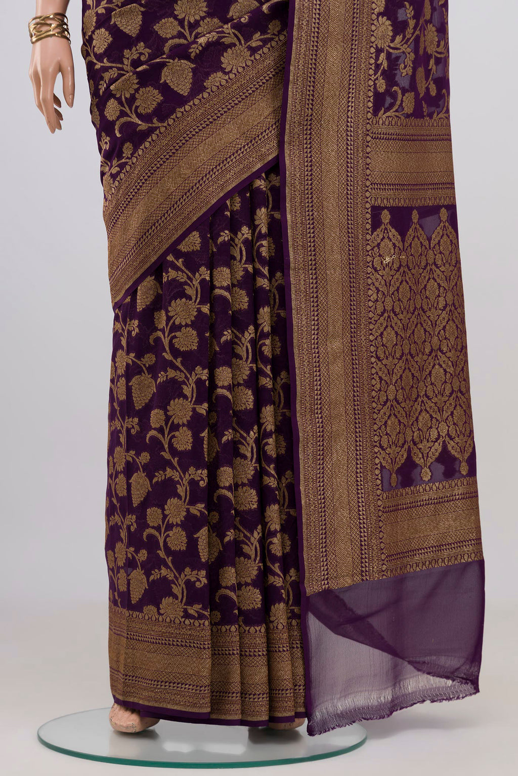 Pleats and pallu of Purple Banarasi Georgette Saree with Zari Brocade on the body and Zari Border. 
