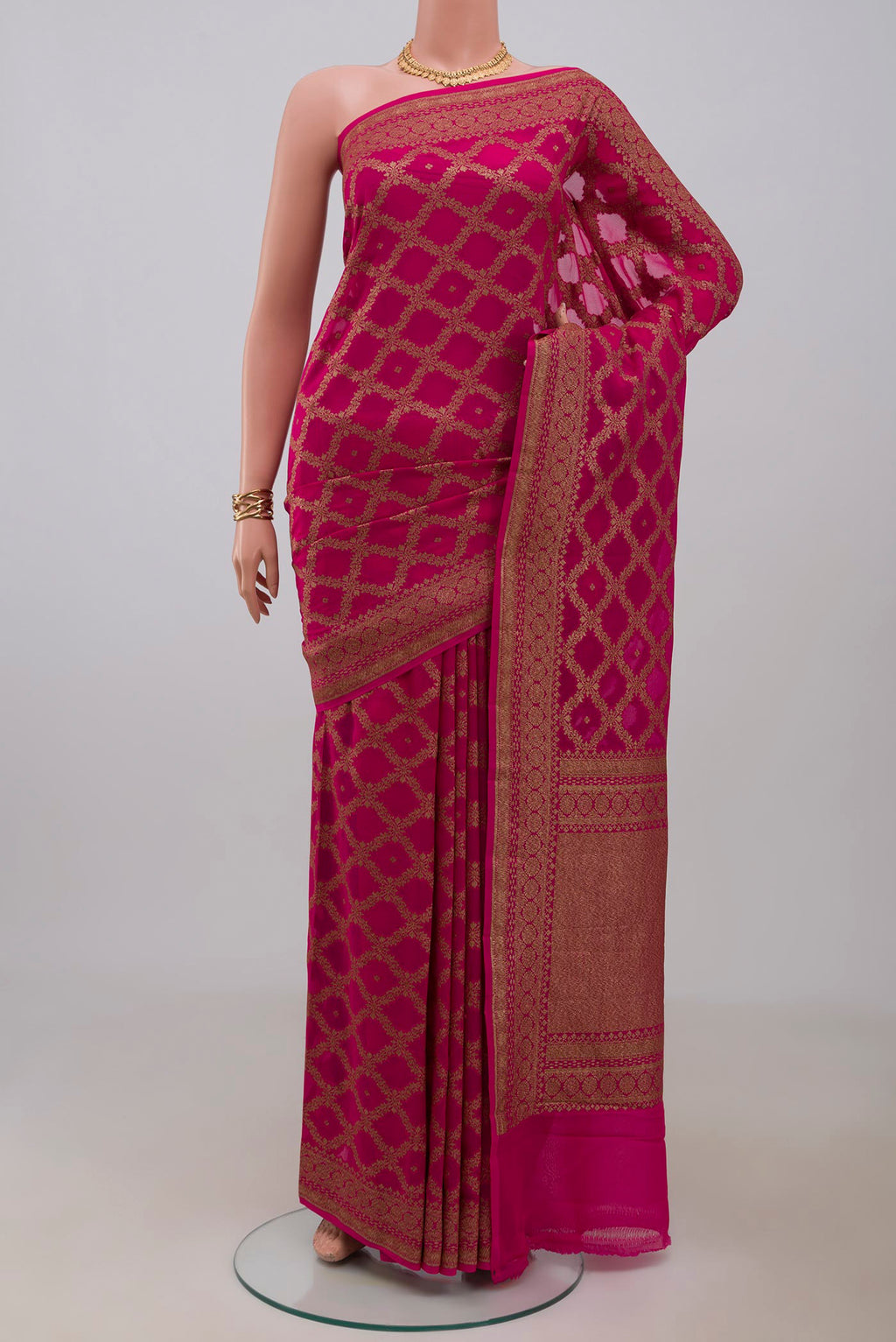 Rani Pink Banarasi Georgette Saree with Zari Butta on the body and Fancy Border.  displayed on a mannequin