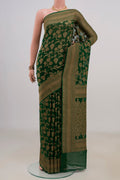 Bottle Green Banarasi Georgette Saree with Zari Brocade on the body and Fancy Border.  displayed on a mannequin