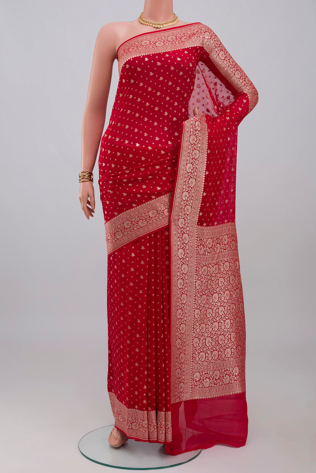 Red Banarasi Georgette Saree with Zari Butta on the body and Zari Border.  displayed on a mannequin