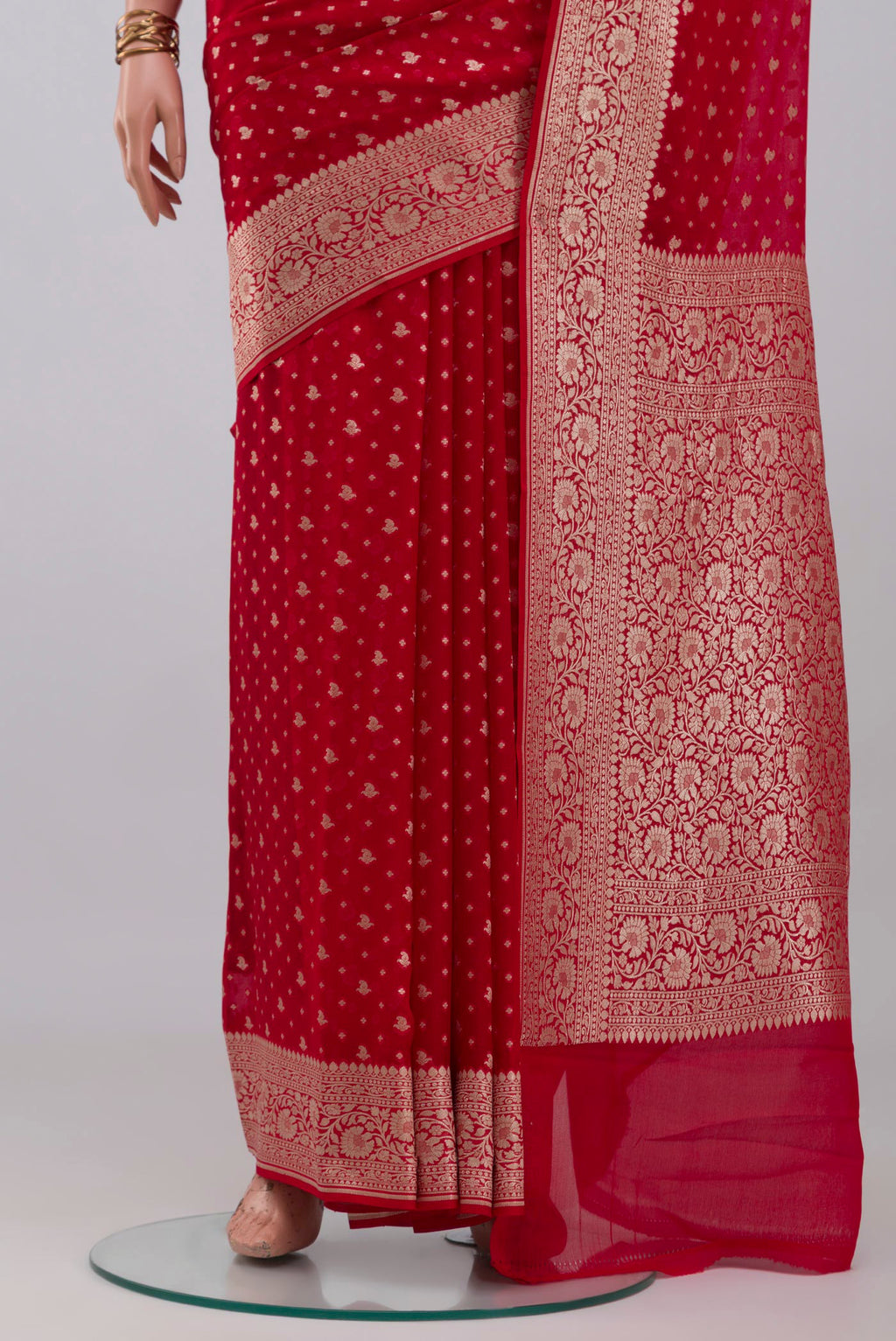 Pleats and pallu of Red Banarasi Georgette Saree with Zari Butta on the body and Zari Border. 