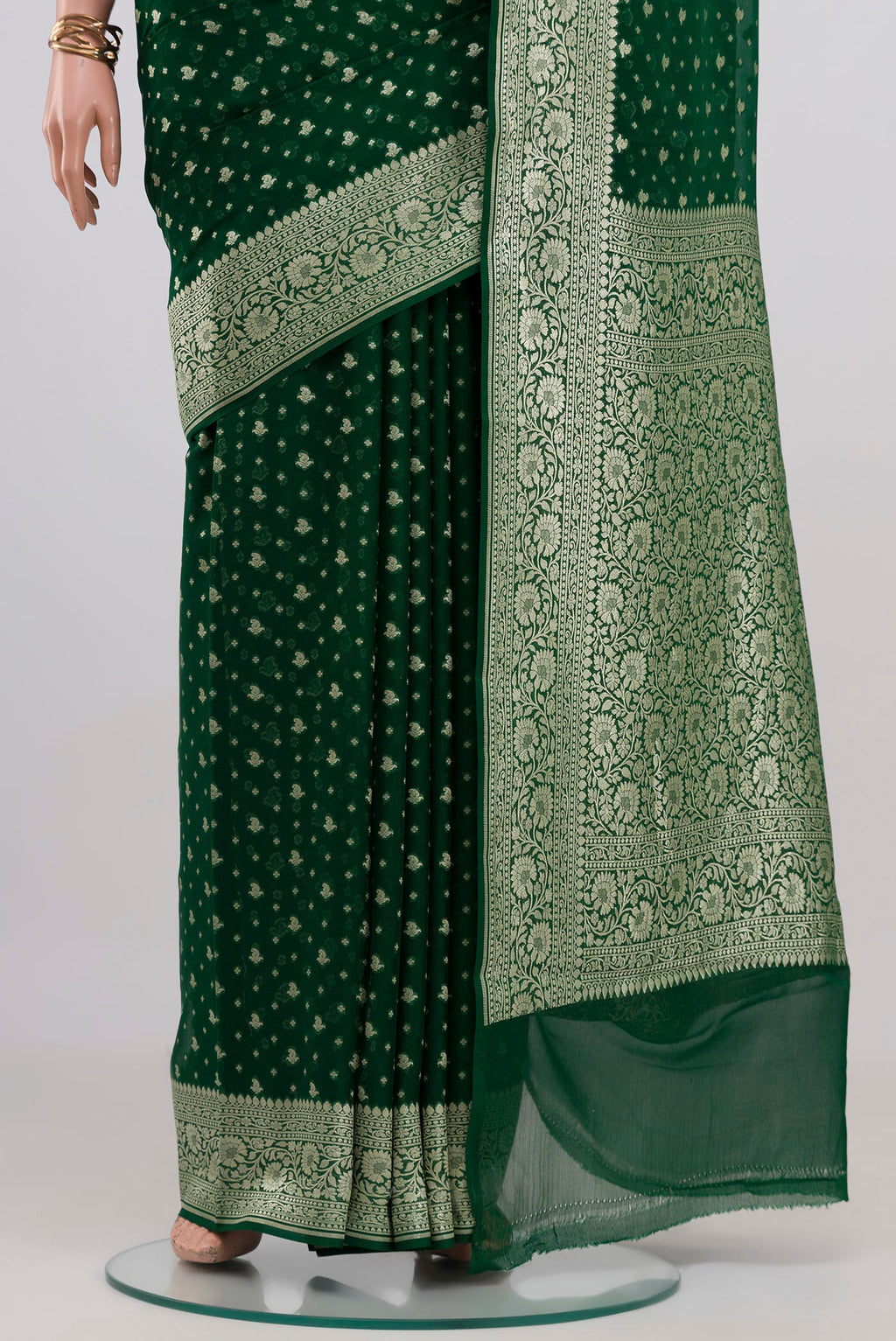 Pleats and pallu of Bottle Green Banarasi Georgette Saree with Zari Butta on the body and Zari Border. 