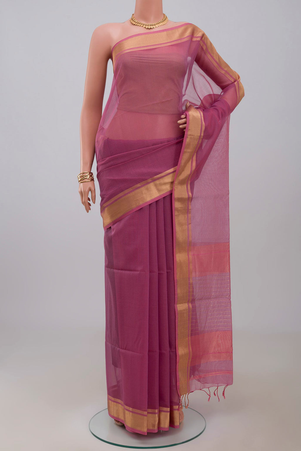 Pink Maheshwari Silk Cotton Saree with Checked design on the body and Zari Border.  displayed on a mannequin