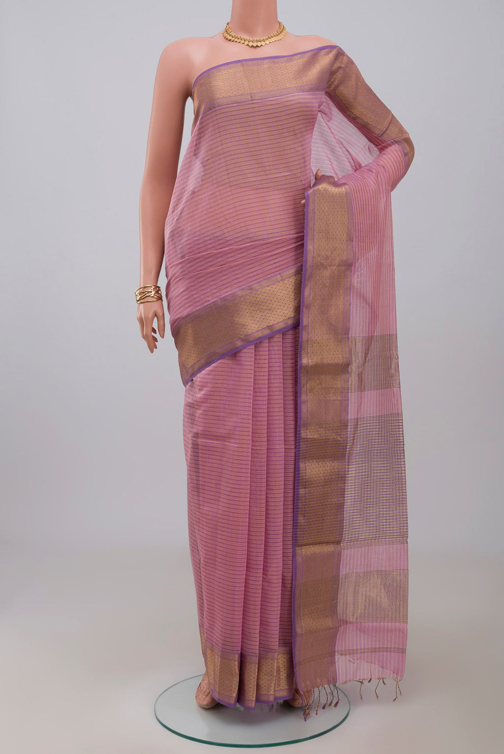 Pink Maheshwari Silk Cotton Saree with Stripes on the body and Zari Border.  displayed on a mannequin