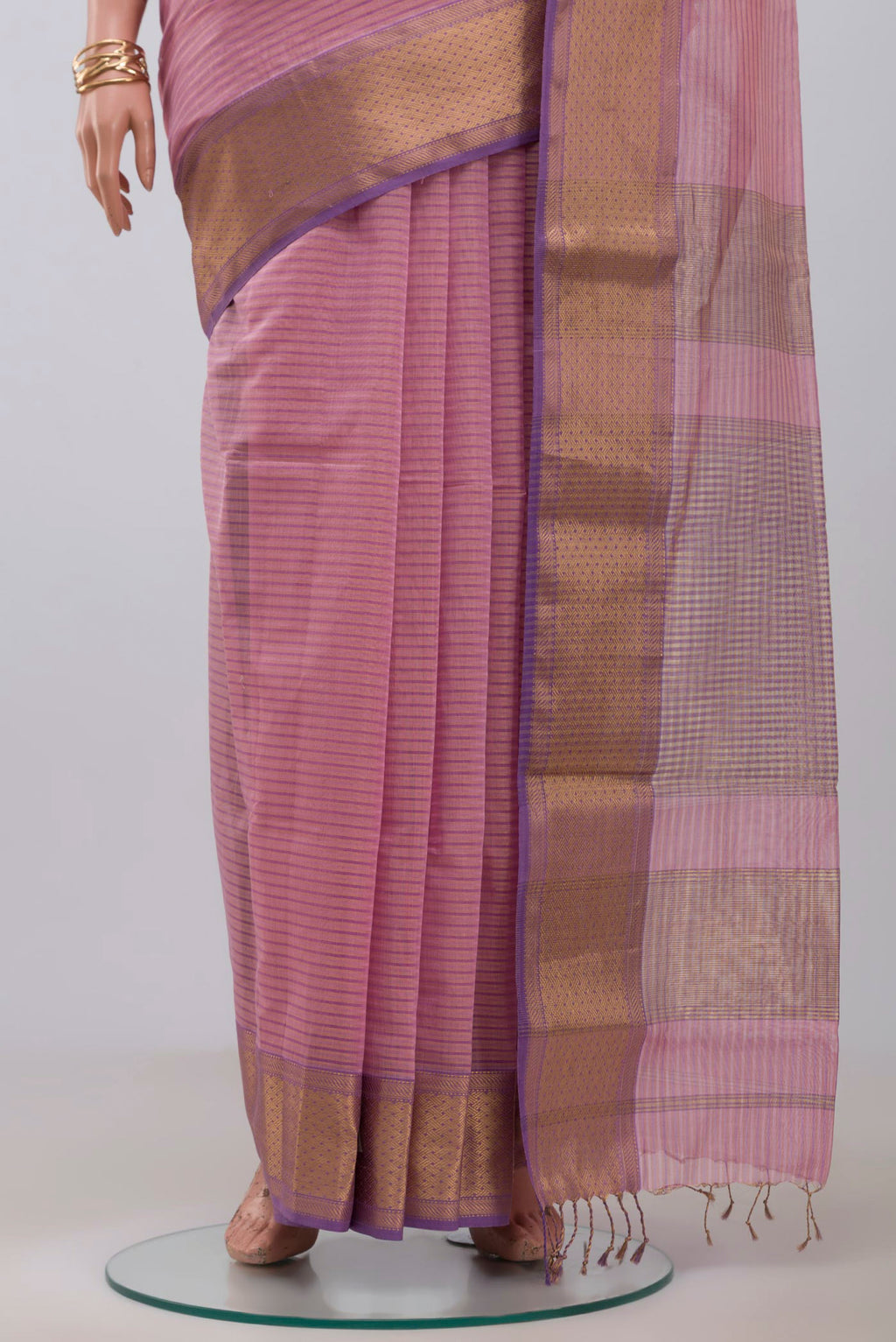 Pleats and pallu of Pink Maheshwari Silk Cotton Saree with Stripes on the body and Zari Border. 