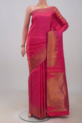Pure Silk Pure Zari Pink Kanchipuram Saree with Plain Body and Temple Border.  displayed on a mannequin