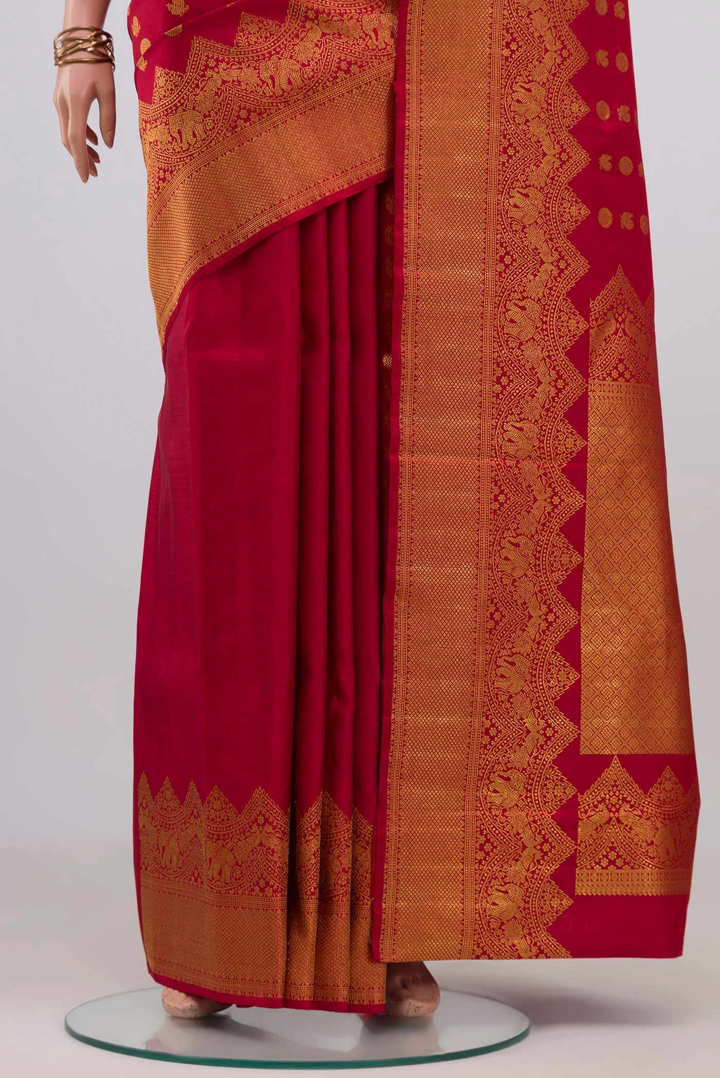 Pleats and pallu of Maroon Kanjivaram Silk Saree with Zari Butta on the body and Fancy Border. 