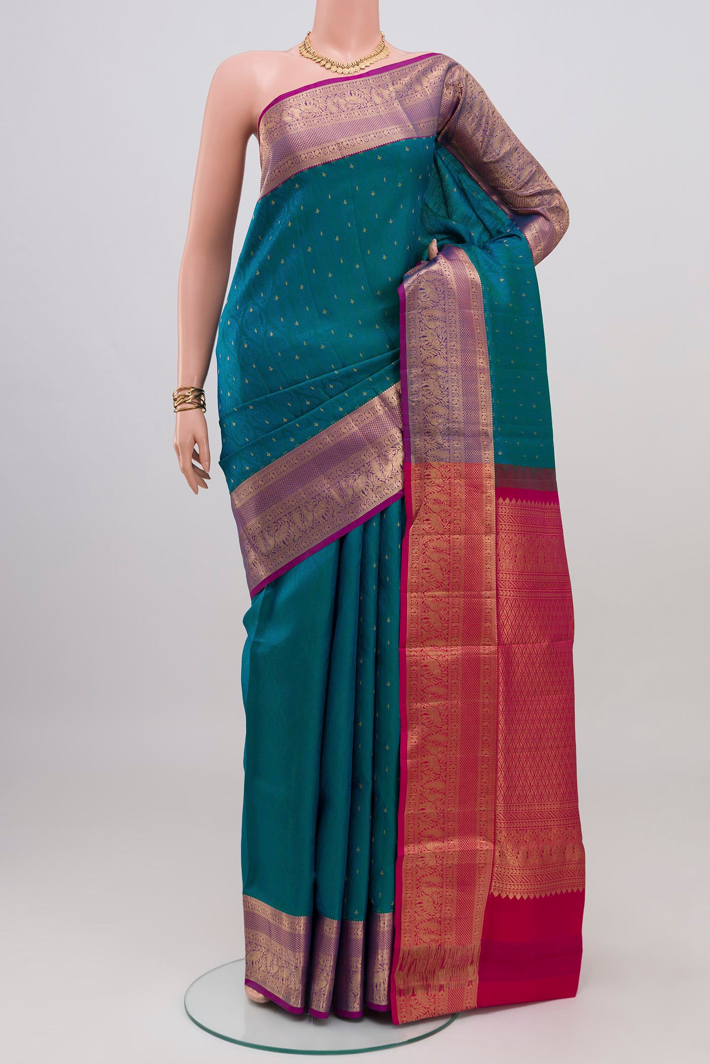 Blue Soft Silk Saree with Jacquard design on the body and Zari Border.  displayed on a mannequin