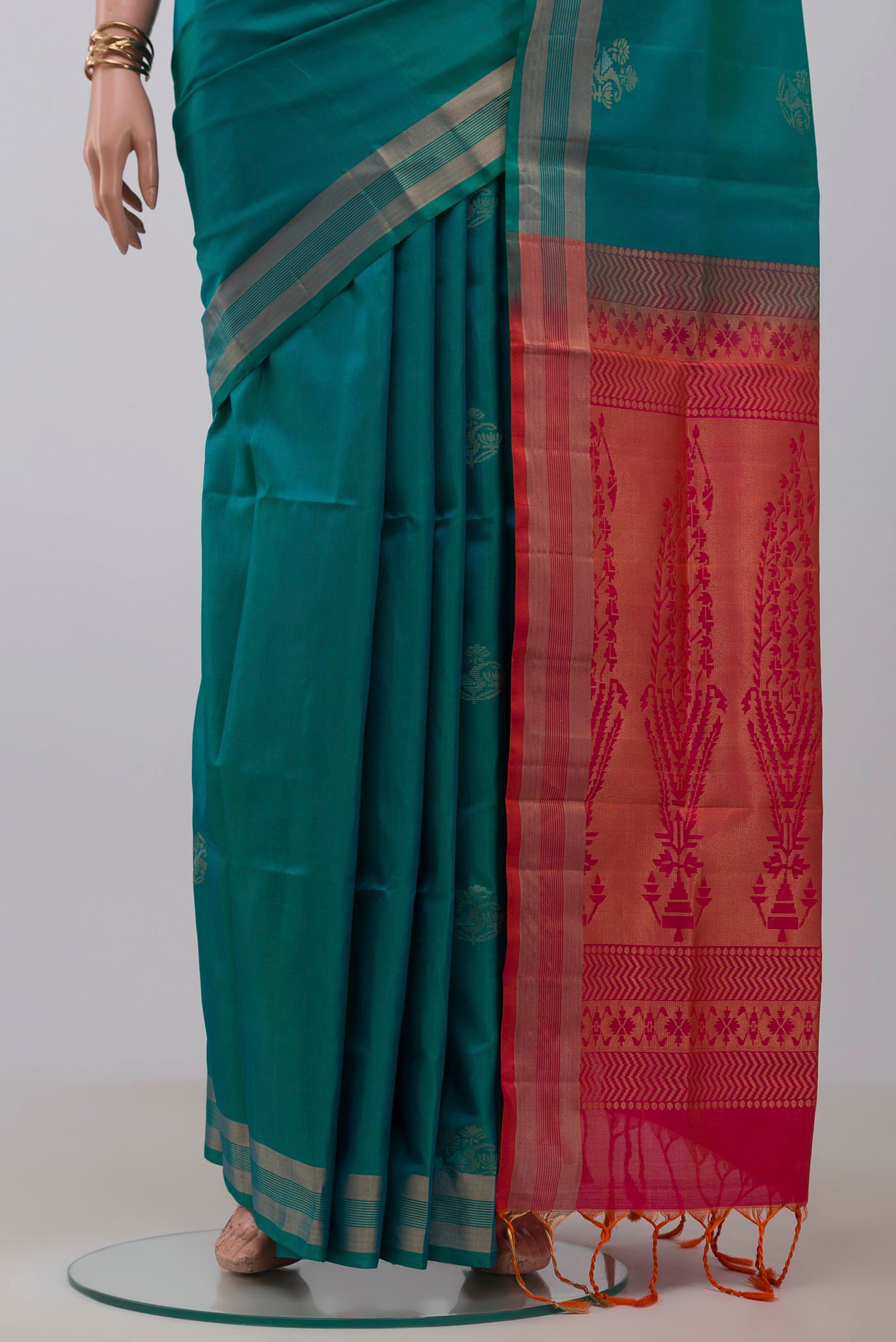 Pleats and pallu of Blue Soft Silk Saree with Zari Butta on the body and Thin Zari Line. 