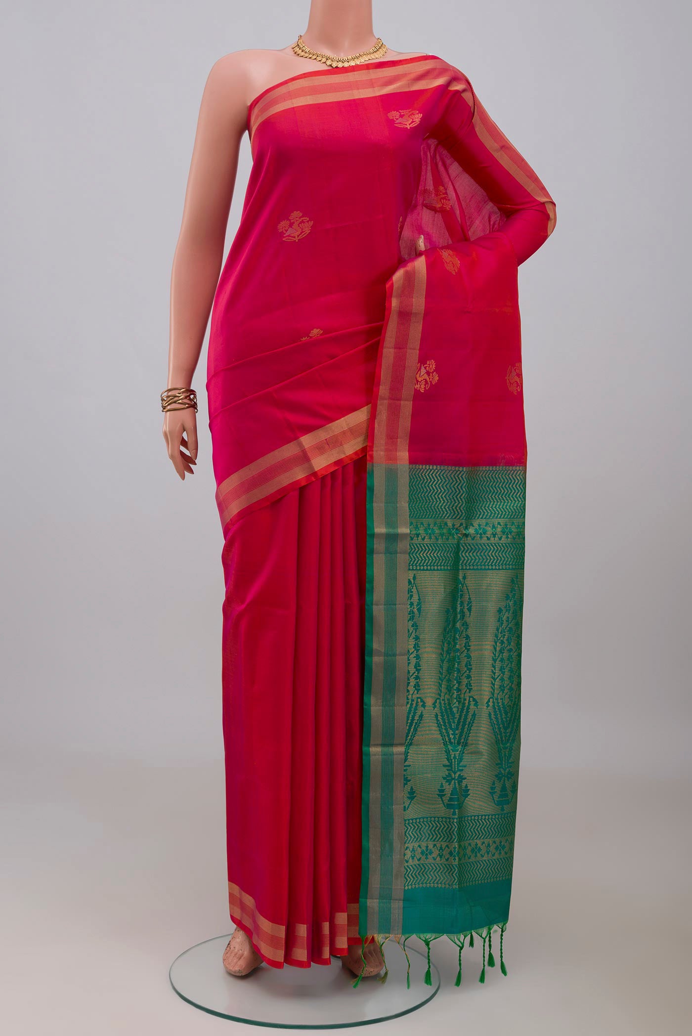 Pink Soft Silk Saree with Zari Butta on the body and Zari Border.  displayed on a mannequin