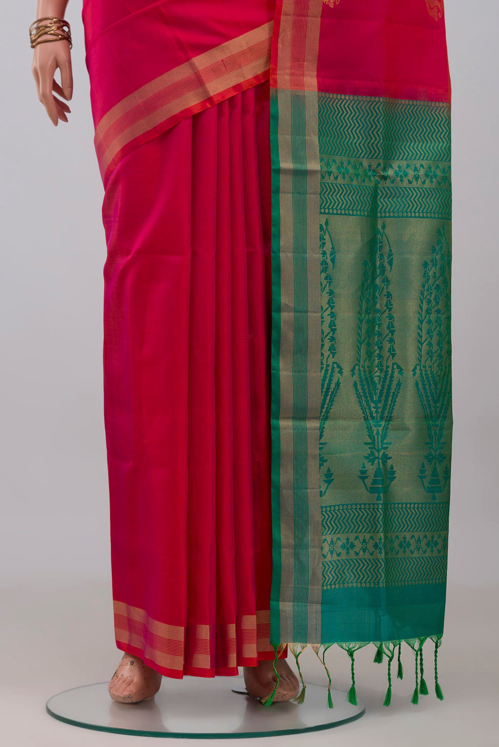 Pleats and pallu of Pink Soft Silk Saree with Zari Butta on the body and Zari Border. 