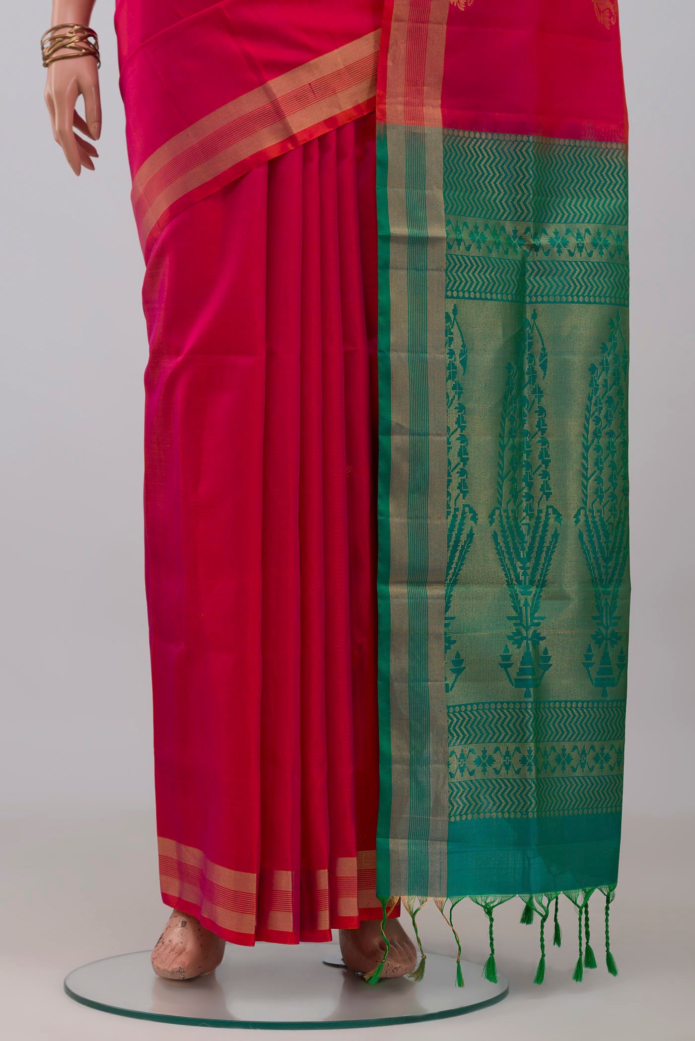 Pleats and pallu of Pink Soft Silk Saree with Zari Butta on the body and Zari Border. 