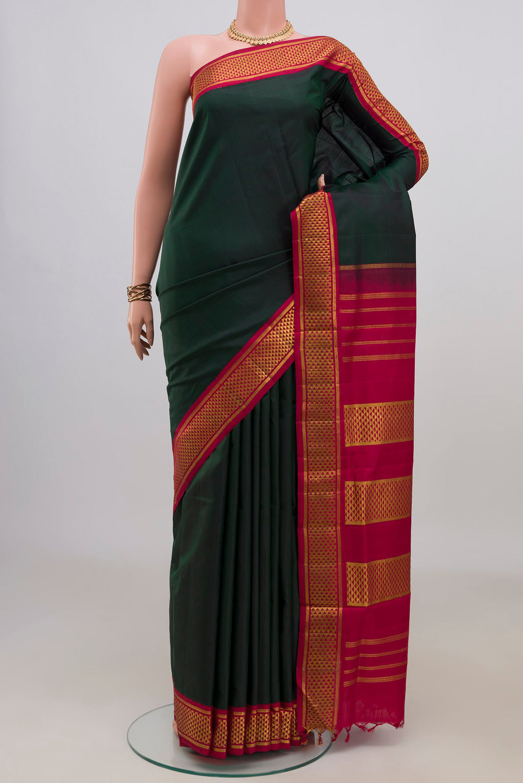 Pure Silk Bottle Green Kanchipuram Nine Yards Saree with Plain Body and Zari Border.  displayed on a mannequin