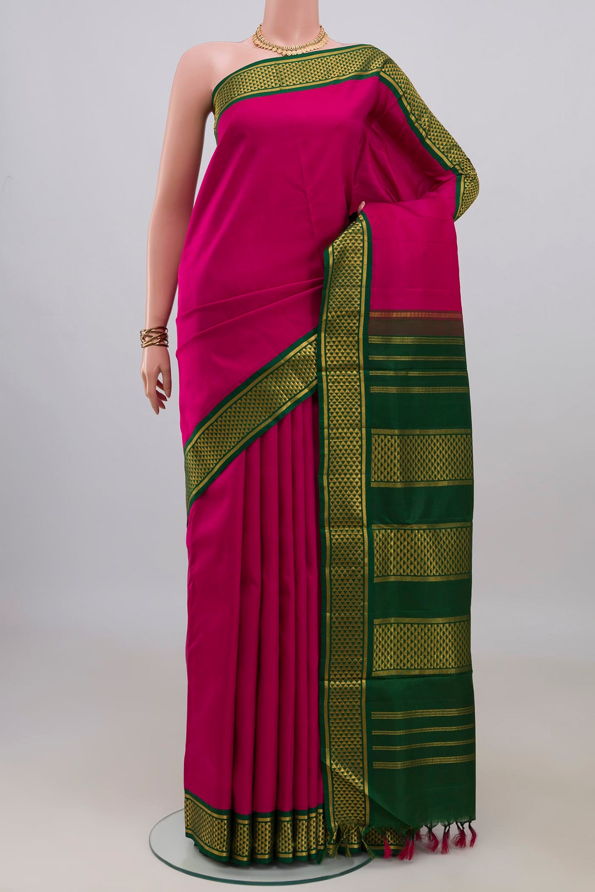 Pure Silk Dark Pink Kanchipuram Nine Yards Saree with Plain Body and Zari Border.  displayed on a mannequin