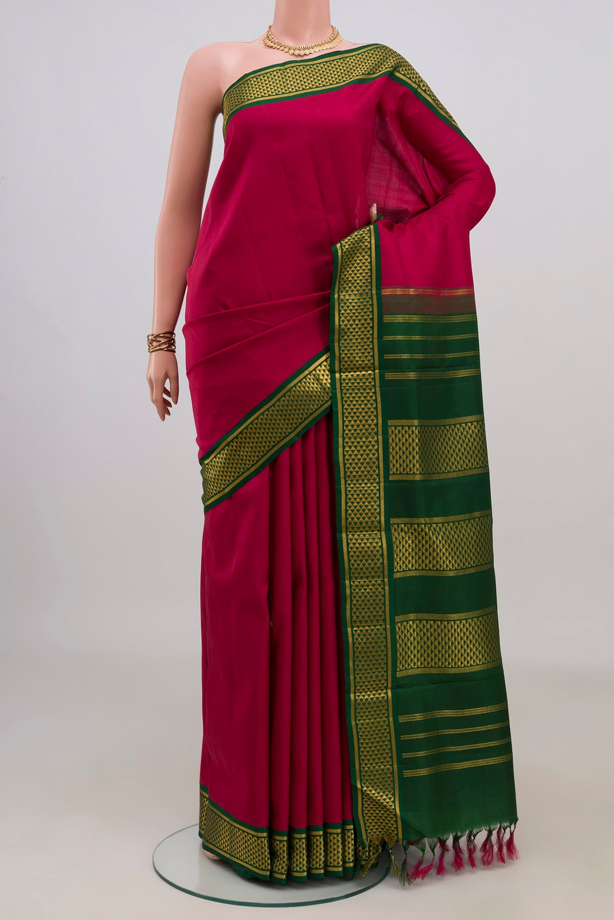Pure Silk Maroon Kanchipuram Nine Yards Saree with Plain Body and Zari Border.  displayed on a mannequin