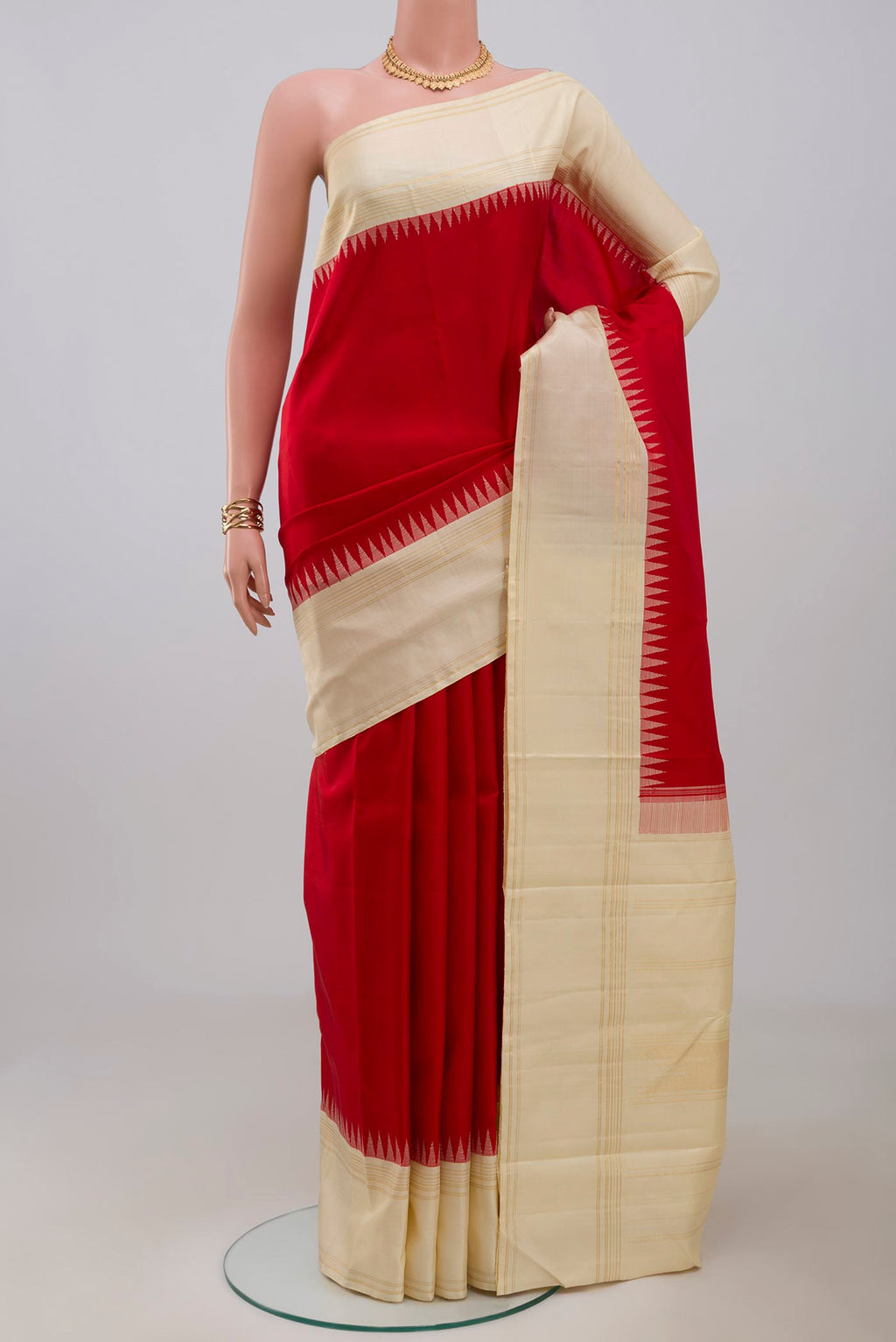 Pure Silk Pure Zari Red Kanjivaram Saree with Plain Body and Thin Zari Line.  displayed on a mannequin