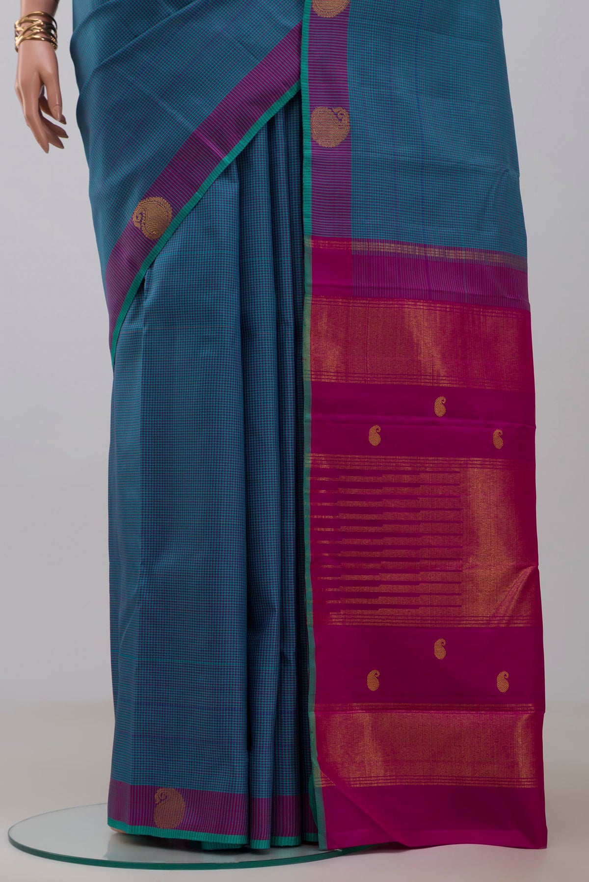 Pleats and pallu of Pure Silk Pure Zari Blue Kanjivaram Saree with Checked design on the body and Fancy Border. 